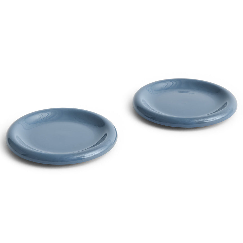 Two blue ceramic plates on a white background
