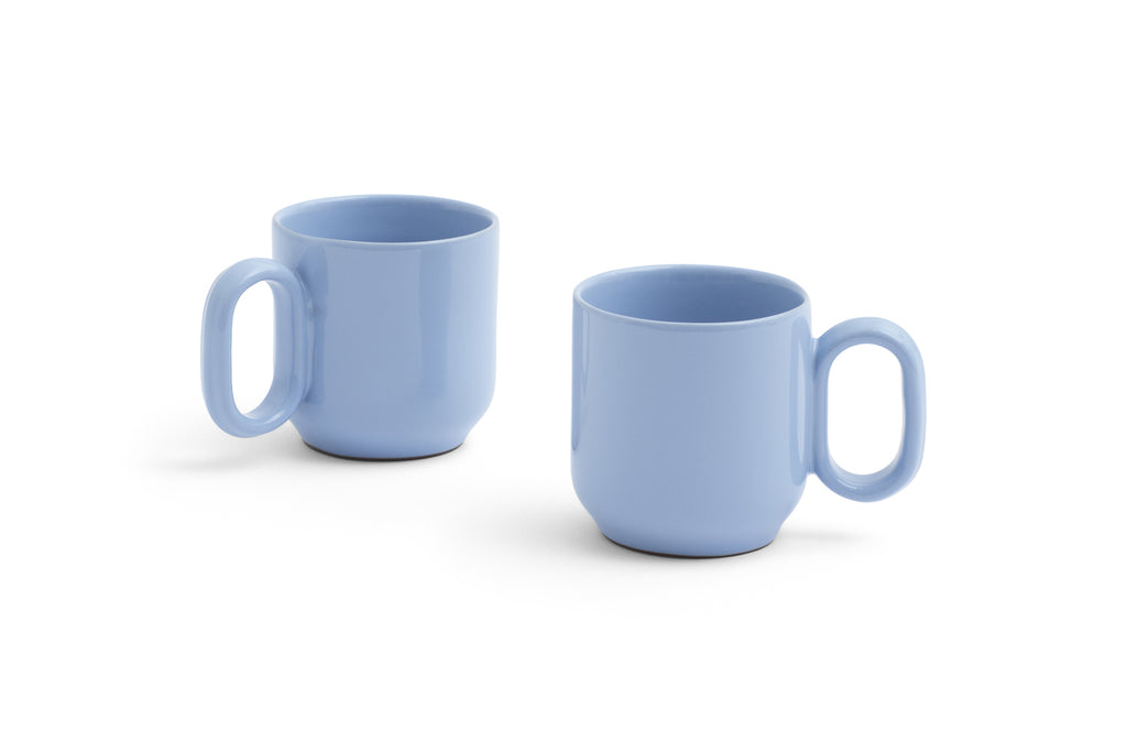 Two light blue mugs on a white background