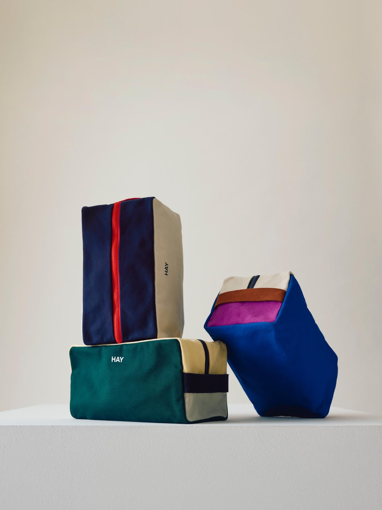 Colorful fabric bags on a light background