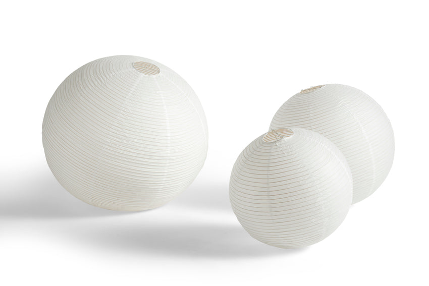 Three white spherical objects on a white background