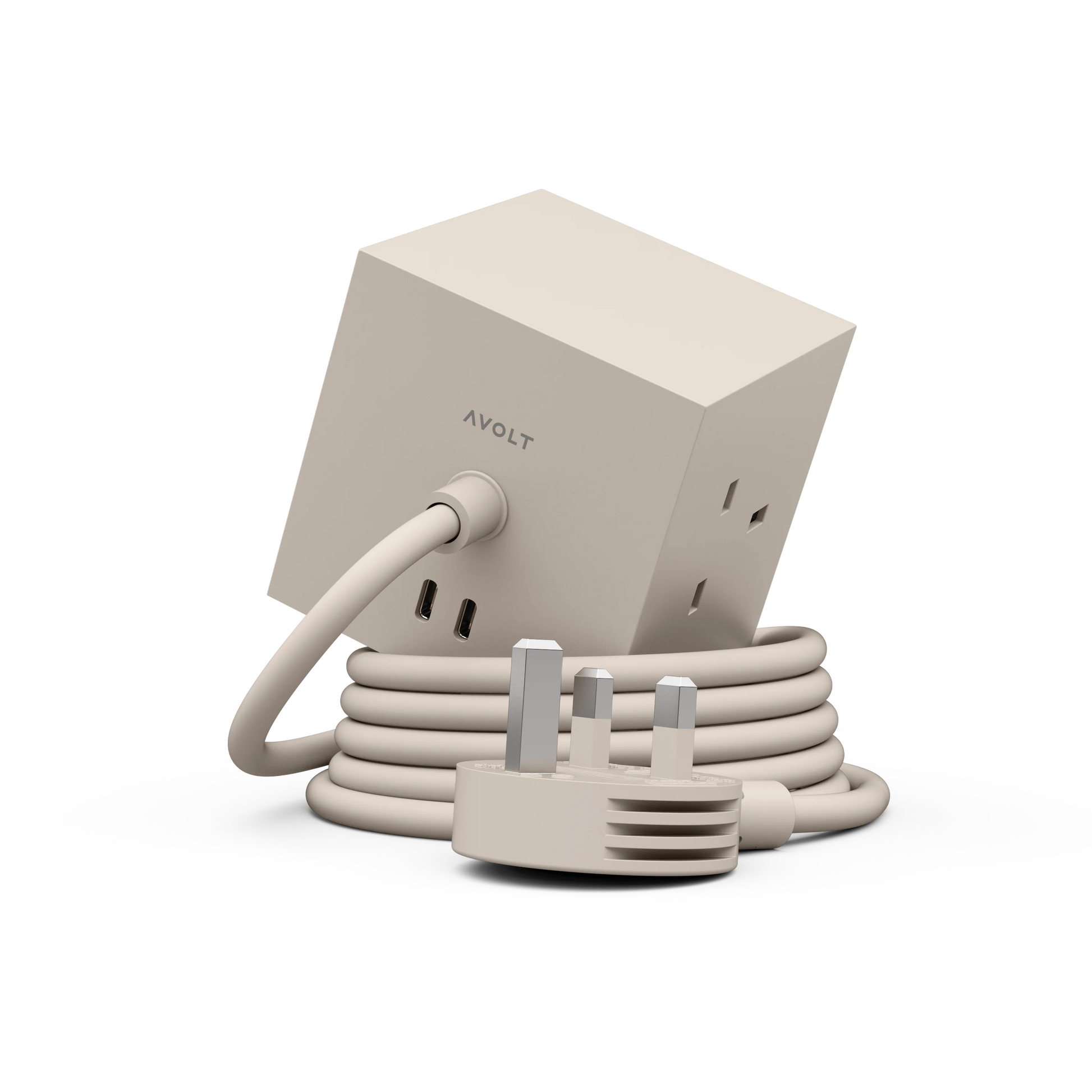 A beige AVOLT power adapter with a cube-shaped body, coiled cable, and UK three-pin plug, shown on a clean white background.