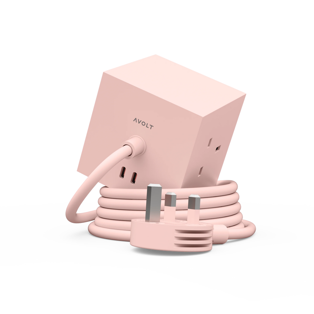 A pink AVOLT power adapter with a coiled cord and UK three-pin plug, shown on a clean white background.