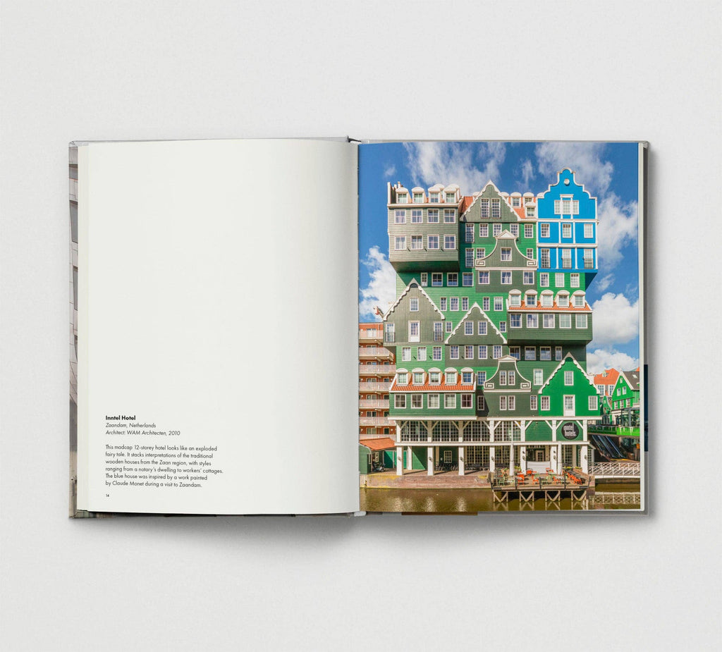 Open book showing a colorful architectural scene with houses and blue sky.