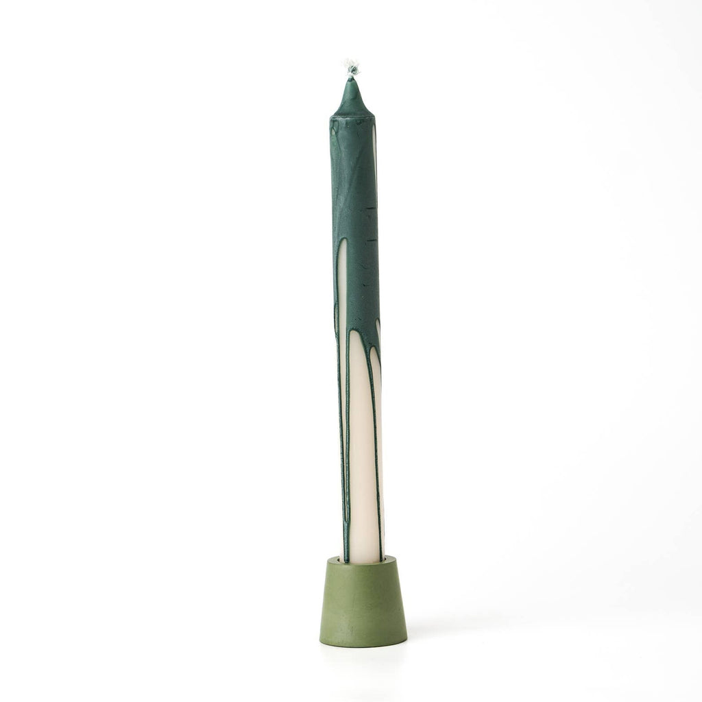 Green candle on a white background