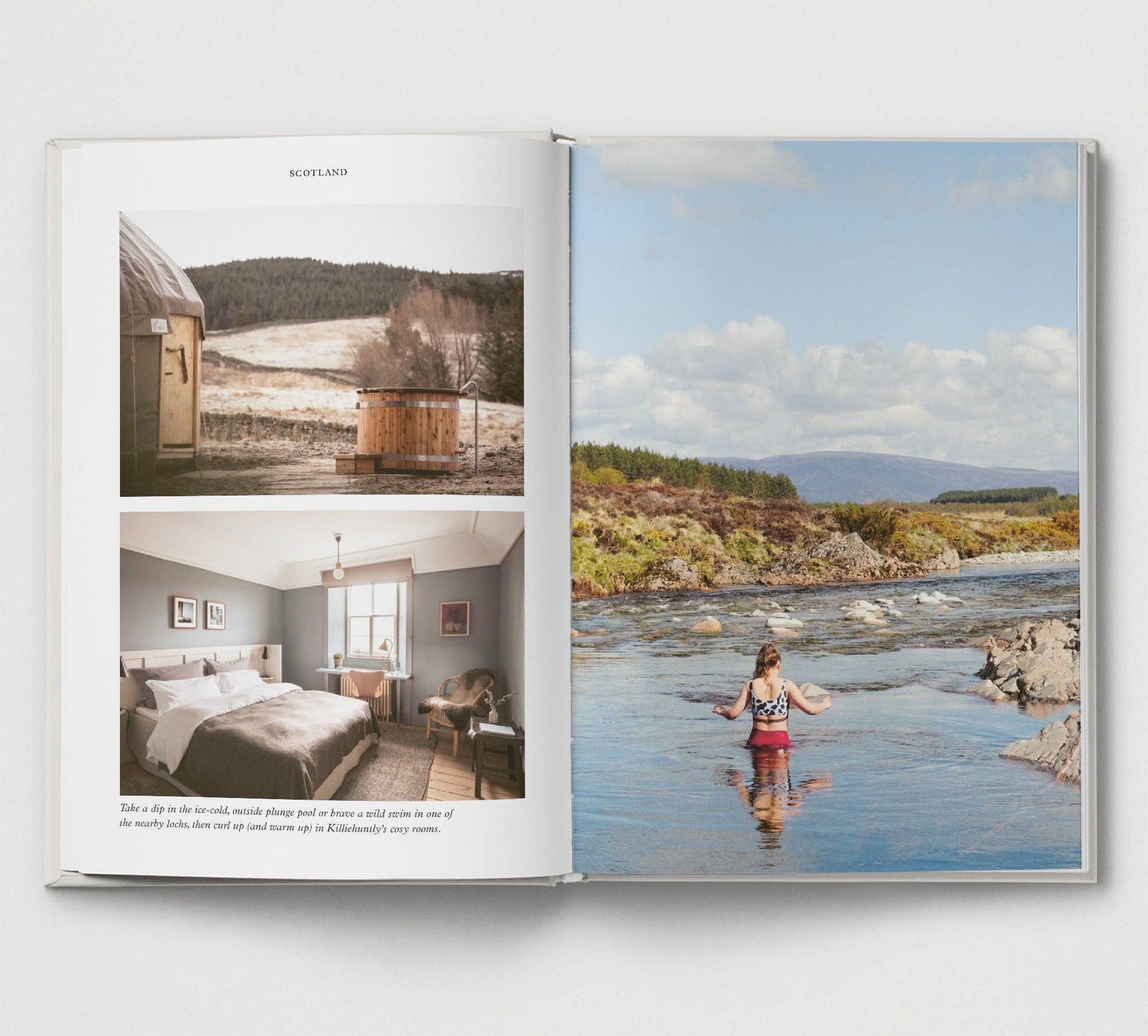 Open book showing images of a cabin and a person by a river.