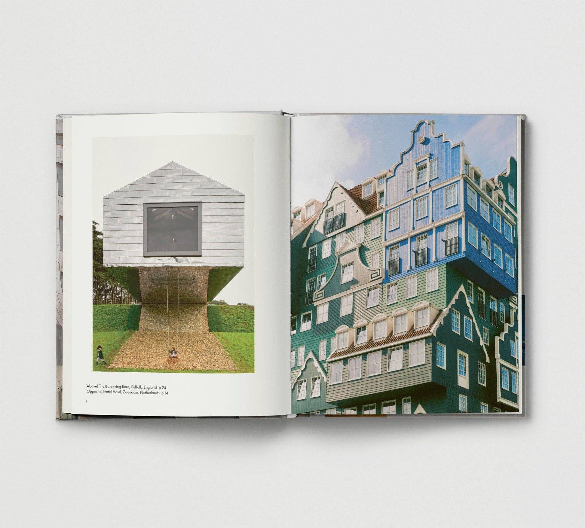 Open book showing two architectural photographs on a white background