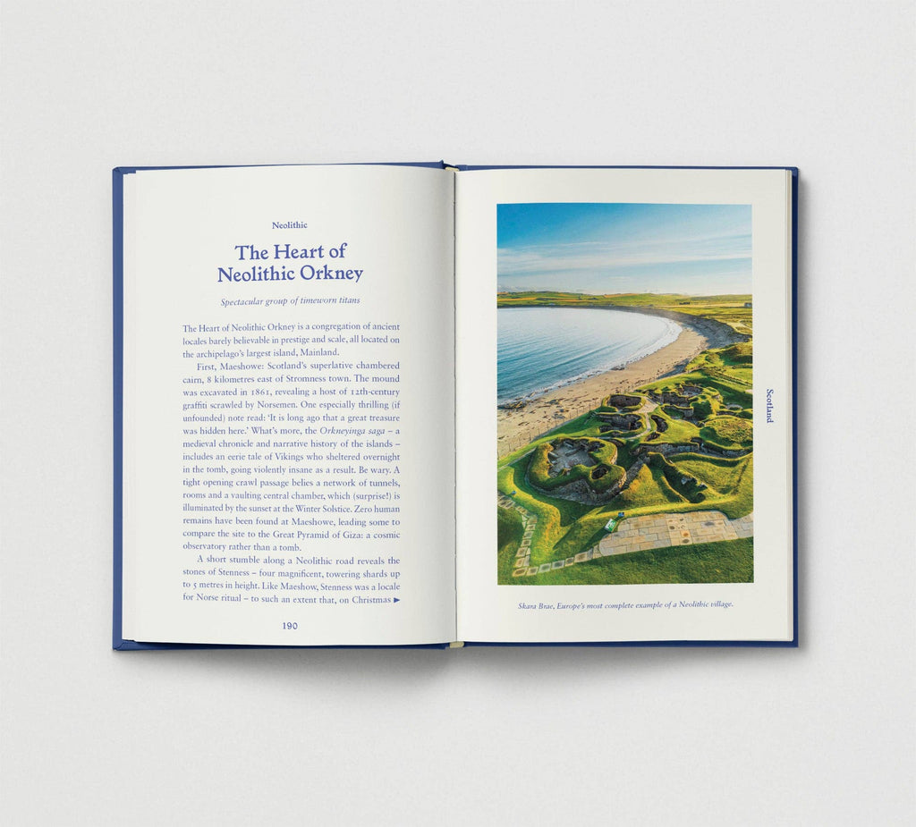 Open book showing a page with text and an image of a coastal landscape.