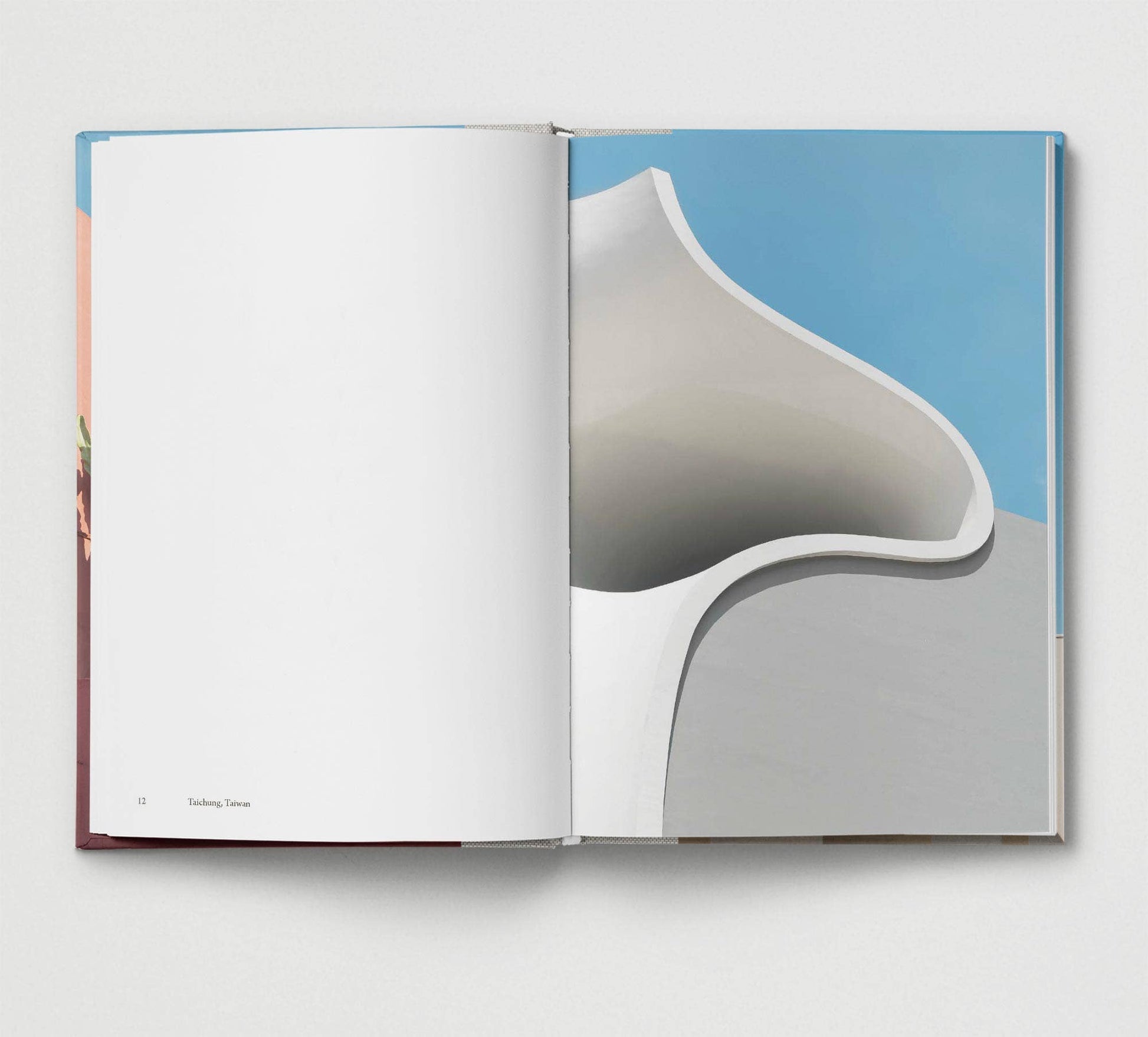 Open book showing a page with a geometric design on a white background