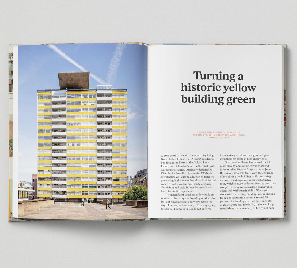 Open book showing a photograph of a yellow building and text on a gray background