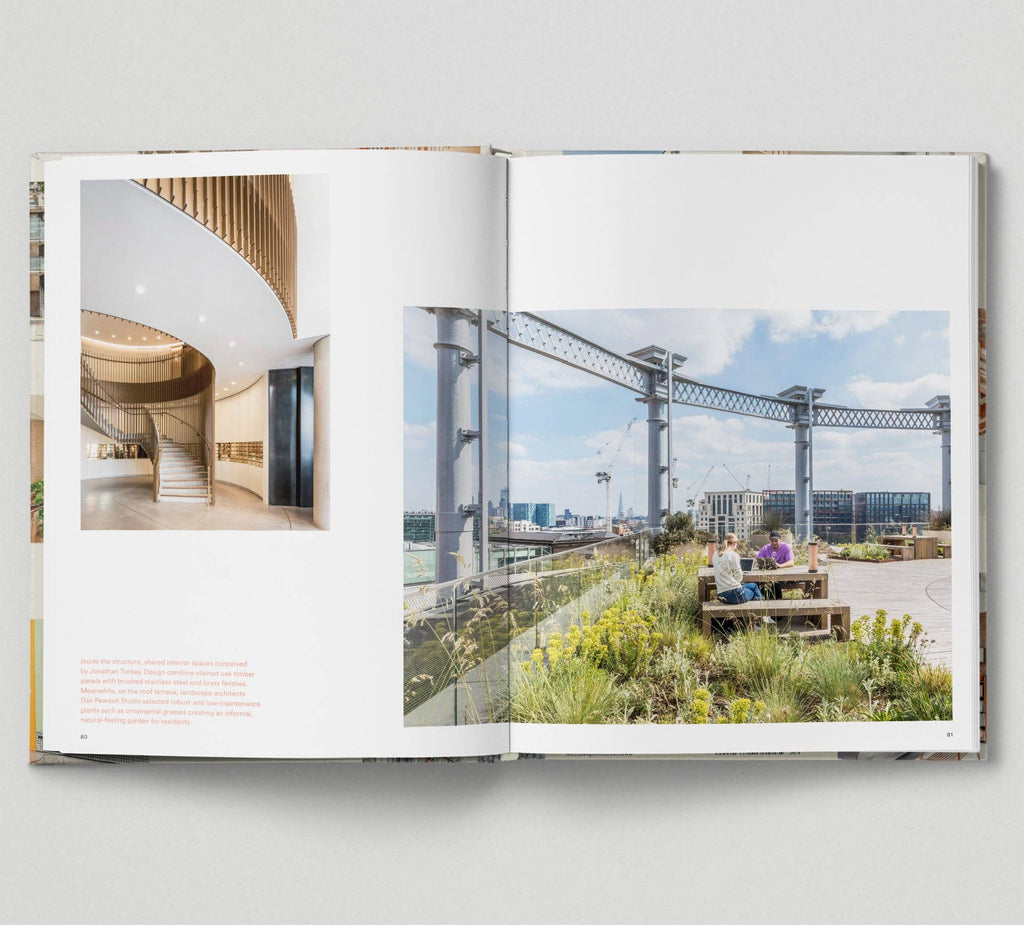 Open book showing interior design and outdoor urban scene