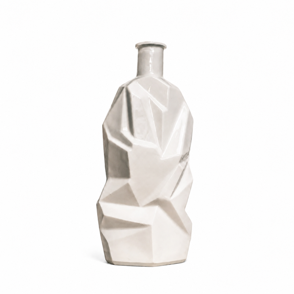 A modern geometric ceramic vase with a faceted, low-poly design in a glossy off-white finish, set against a plain white background.