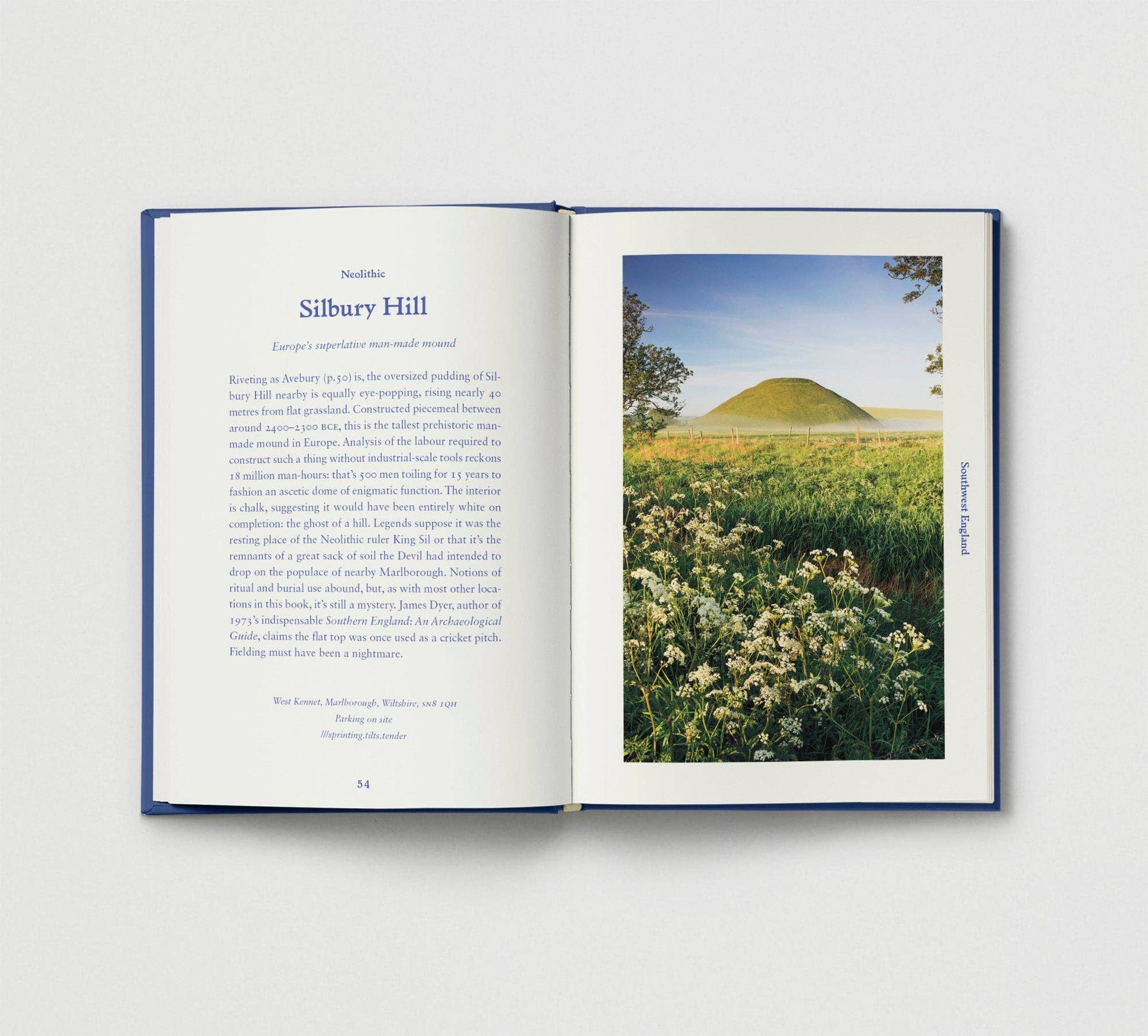 Open book with a photograph of Silbury Hill on a white background