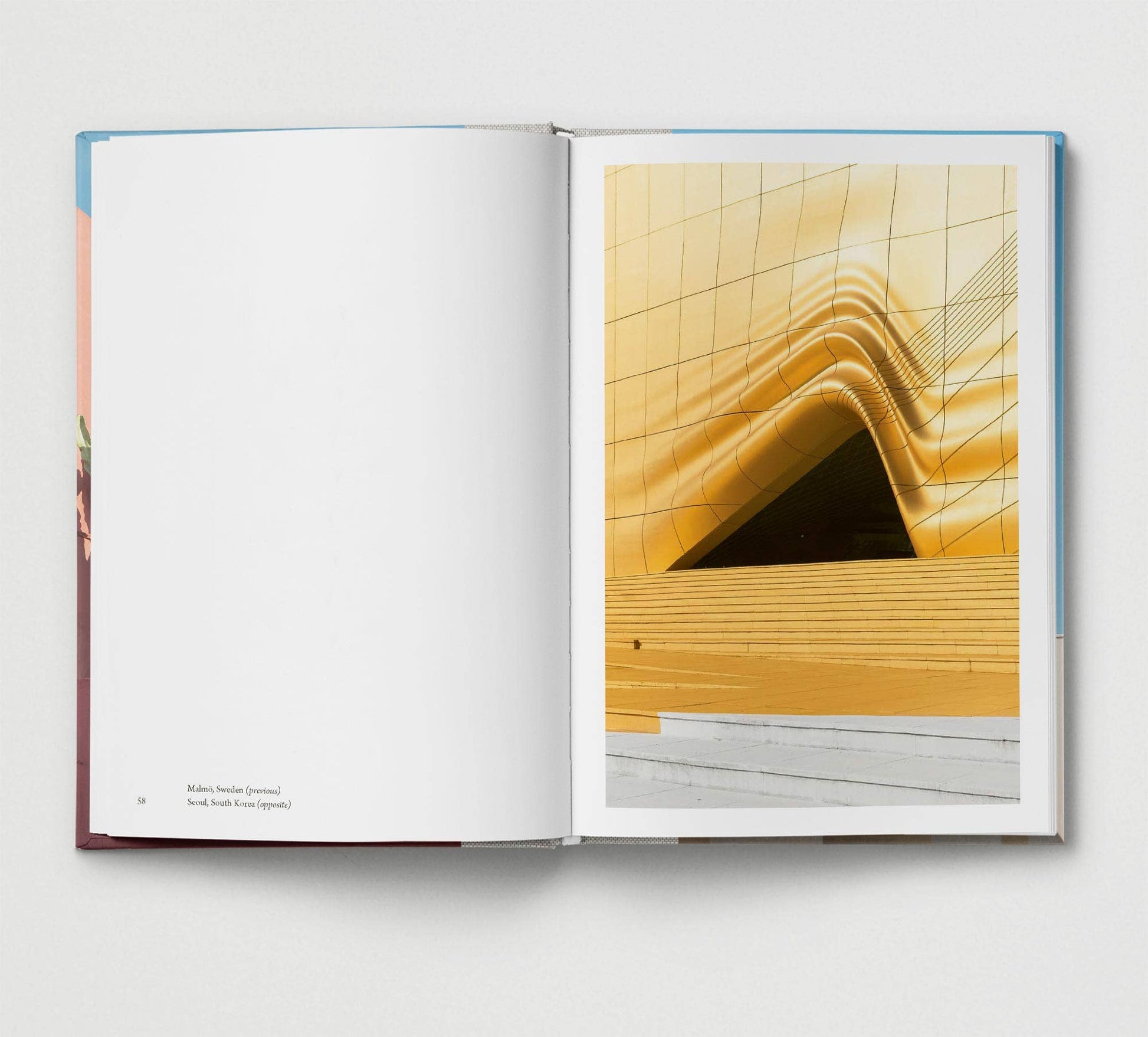 Open book showing a page with architectural design on a white background