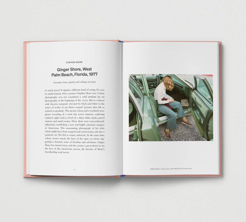 Open book showing a photograph of a person sitting in a car with text on a white background