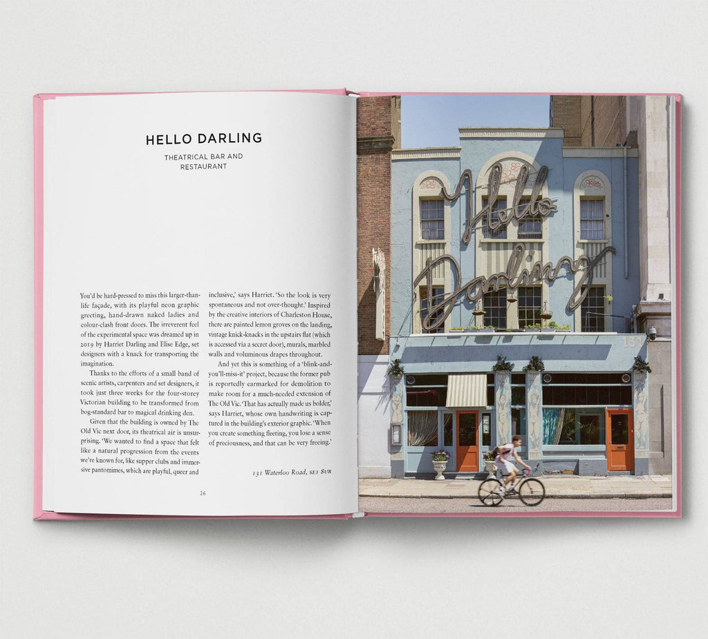 Open book showing a photograph of a building with 'Hello Darling' sign and text on the left page.