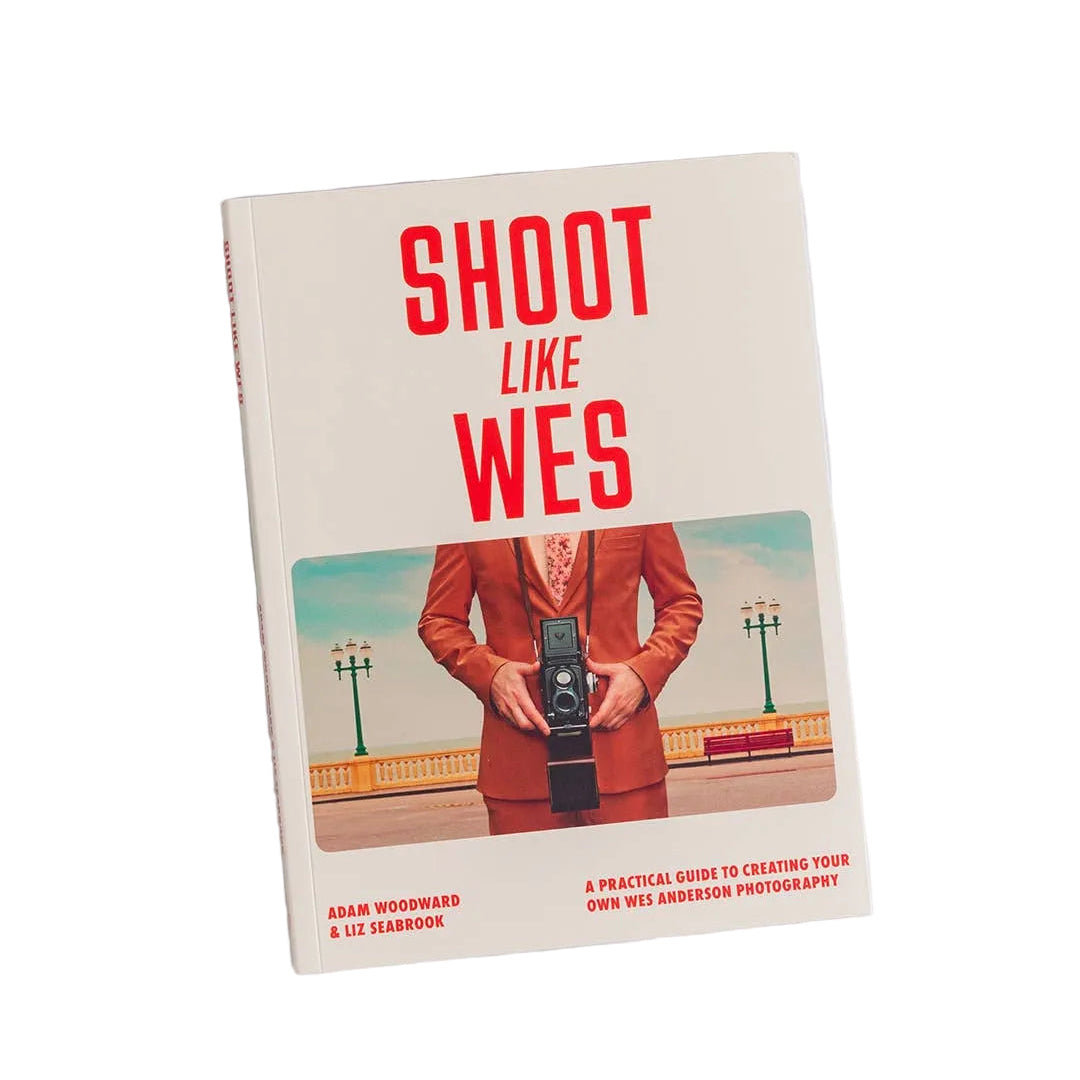 Book titled 'Shoot Like Wes' on a marble surface